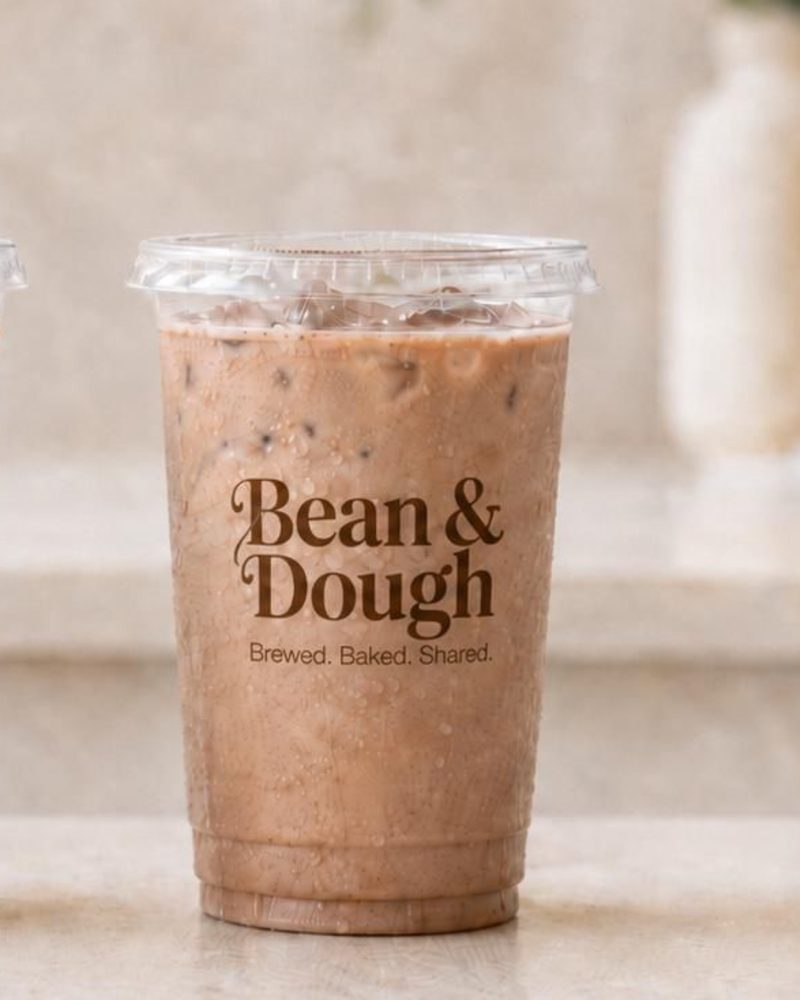 Bean & Dough iced coffee in a branded clear cup