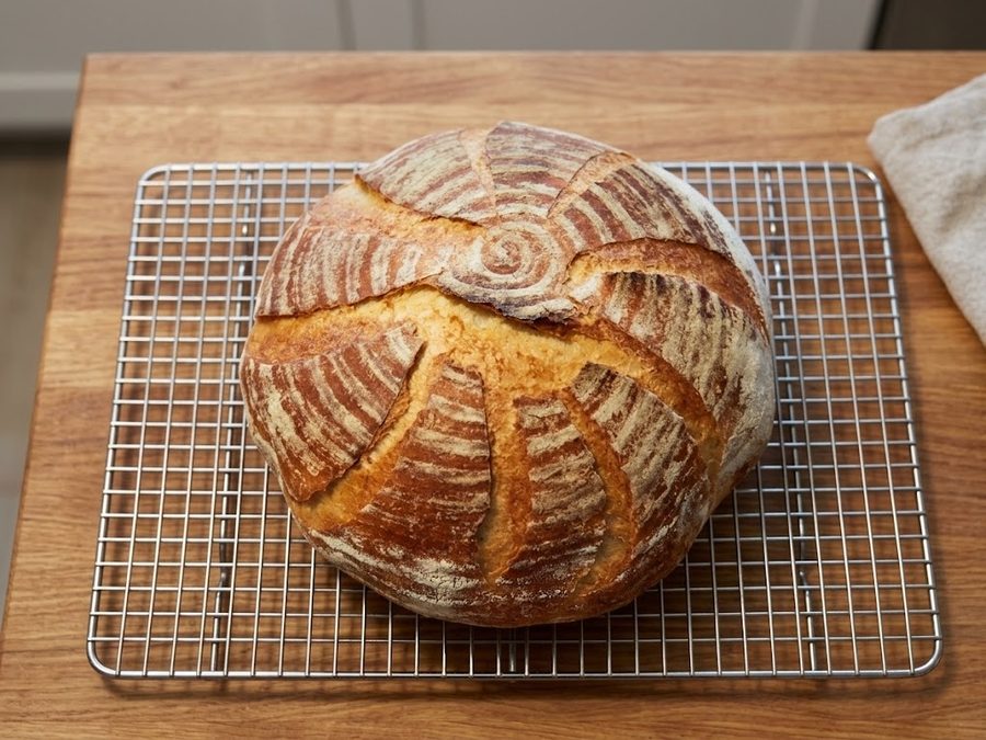 Scored artisan sourdough loaf, fresh from the oven